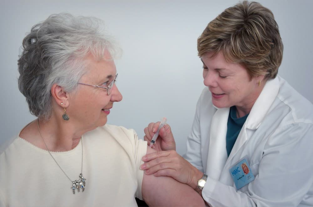 Healthcare volunteer conducting health checkup for rural families
